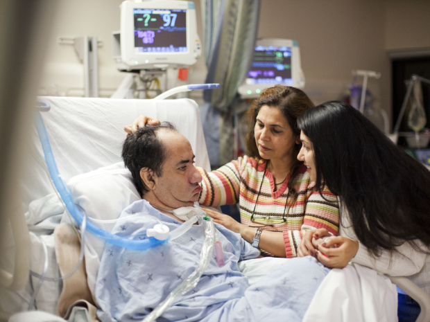 Hassan Rasouli is seen with his family in Sunnybrook Hospital's intensive care unit