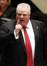 Toronto Mayor Rob Ford gestures during a special council meeting at City Hall in Toronto