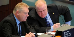 Jan. 10, 2011 - Toronto, Ontario, Canada - - Mayor Ford (right) chats with his brother Councillor Doug Ford (left) as councillors discuss the budget..Mayor Rob Ford today announced his 2011 city budget at City Hall.  There is no property tax increase but