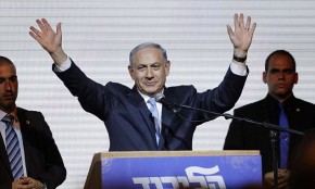 Israeli Prime Minister Benjamin Netanyahu waves to supporters at the party headquarters in Tel Aviv