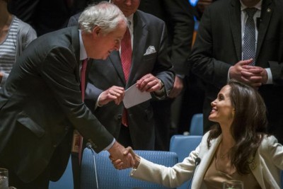 Jolie greets Grant before a United Nations Security Council meeting in New York